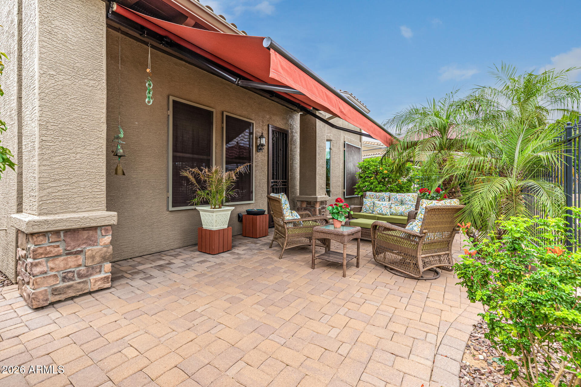 6202 East McKellips Road, Unit 297 Mesa, AZ 85215 - Photo 39 of 57 a view of a patio with table and chairs and potted plants