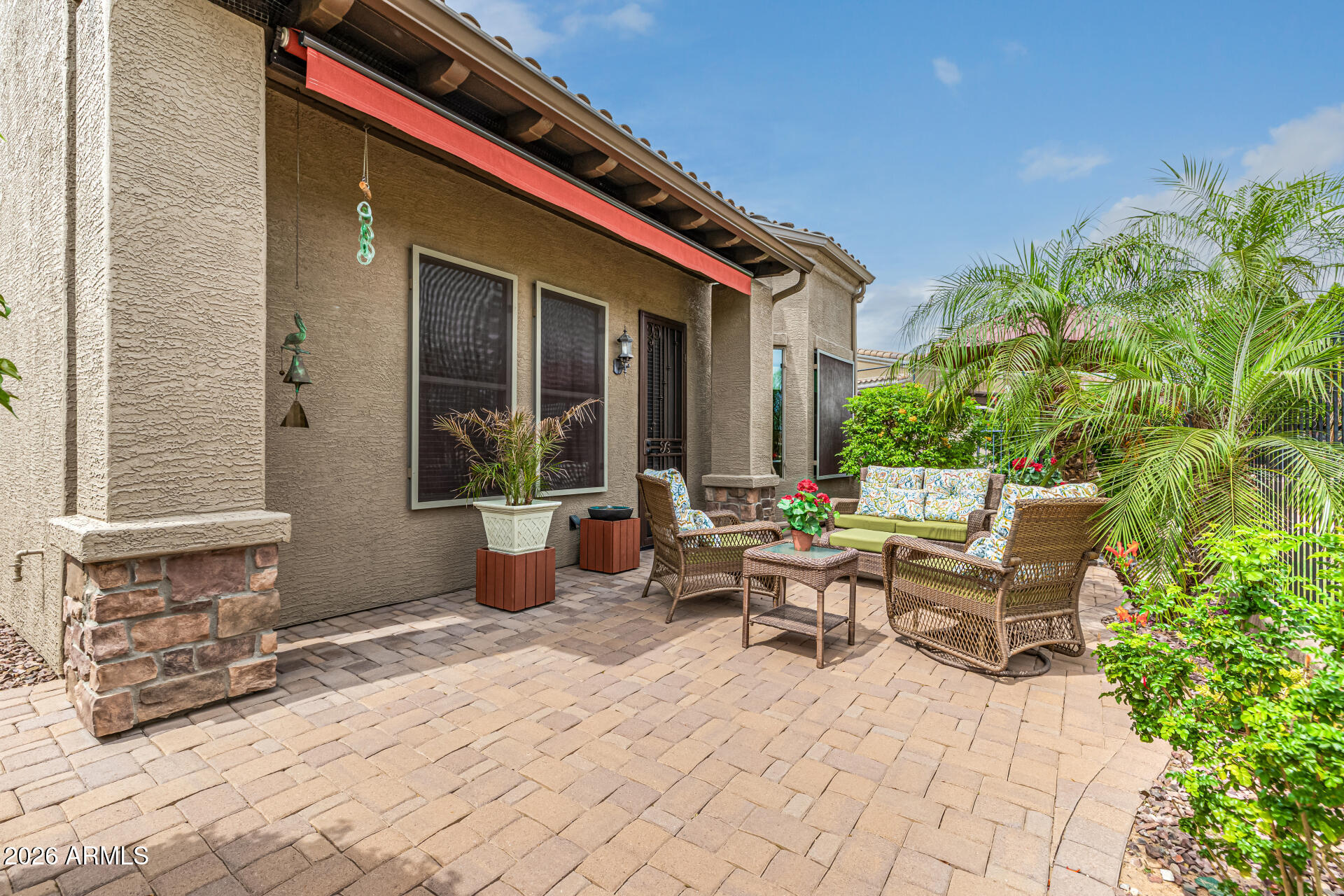 6202 East McKellips Road, Unit 297 Mesa, AZ 85215 - Photo 42 of 57 a building outdoor space with patio furniture and potted plants