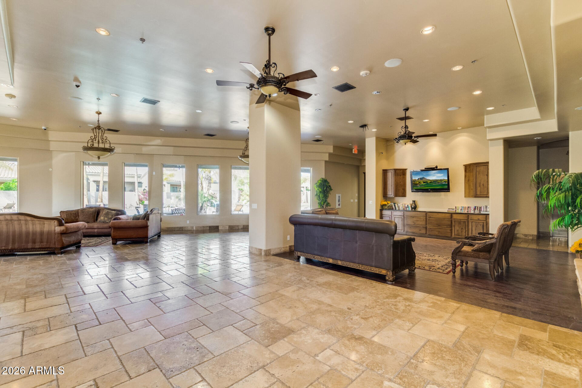 6202 East McKellips Road, Unit 297 Mesa, AZ 85215 - Photo 49 of 57 a lobby with furniture and a ceiling fan