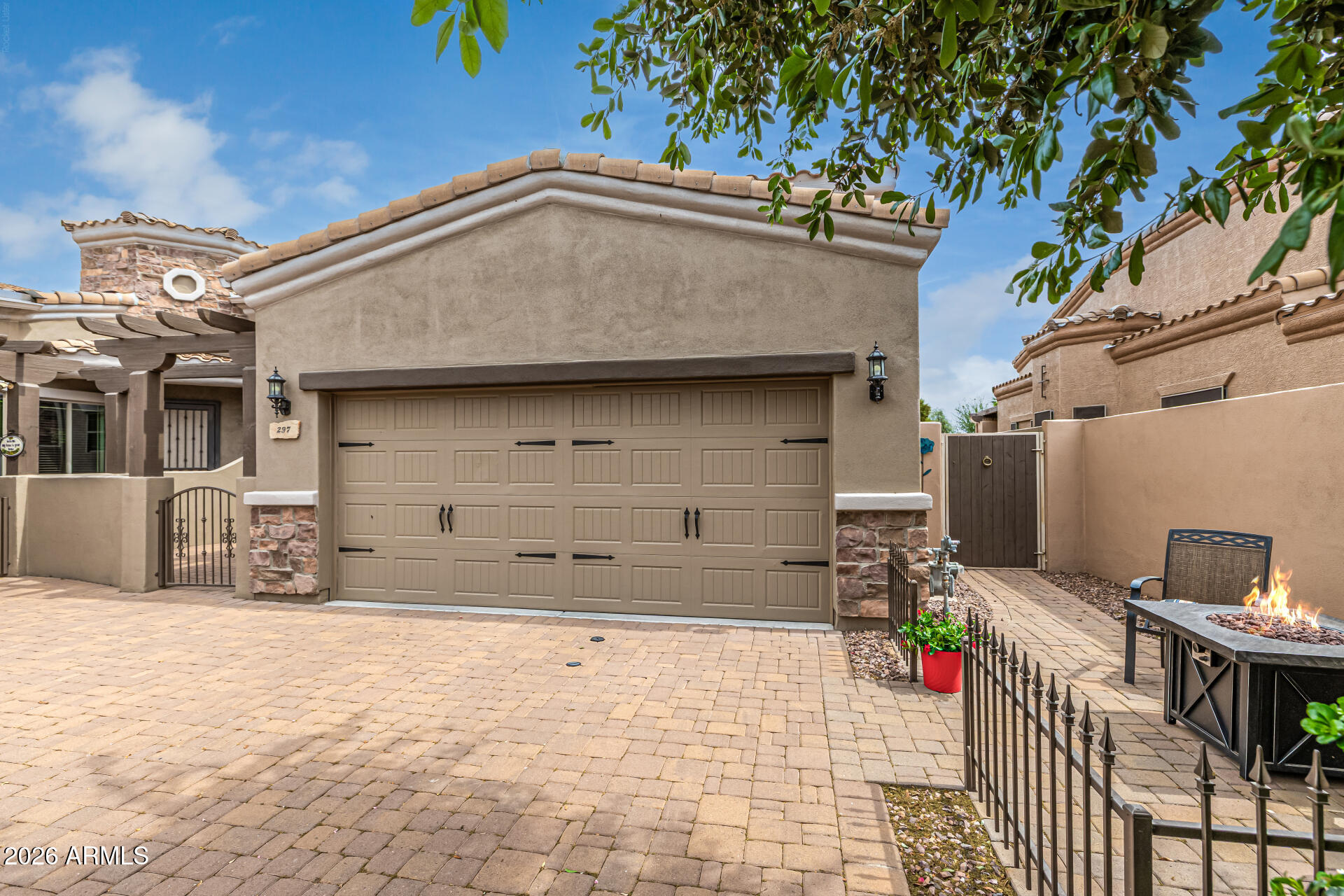 6202 East McKellips Road, Unit 297 Mesa, AZ 85215 - Photo 5 of 57 a front view of a house with a garage