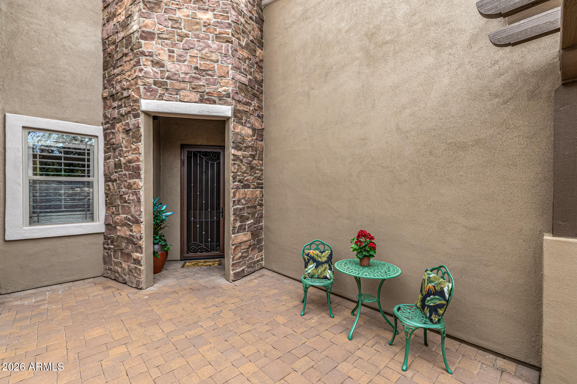 6202 East McKellips Road, Unit 297 Mesa, AZ 85215 - Photo 8 of 57 a backyard of a house with table and chairs