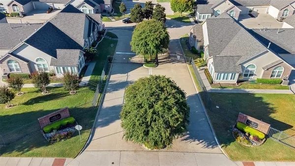 an aerial view of a house with garden space ocean view