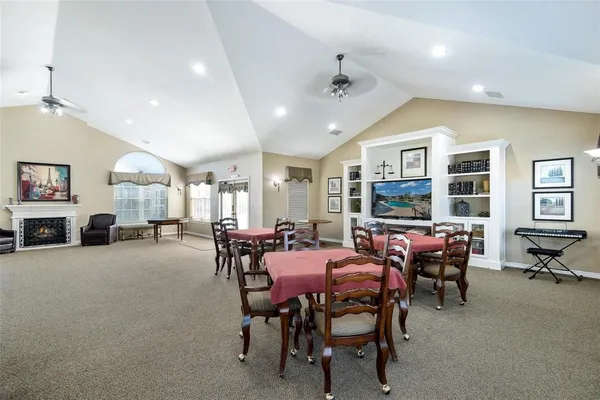 a view of a dining room with furniture and a livingroom