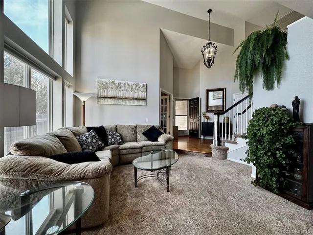 a kitchen with stainless steel appliances kitchen island granite countertop a refrigerator and a stove