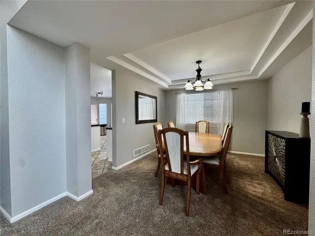 a kitchen with stainless steel appliances granite countertop a stove and a refrigerator