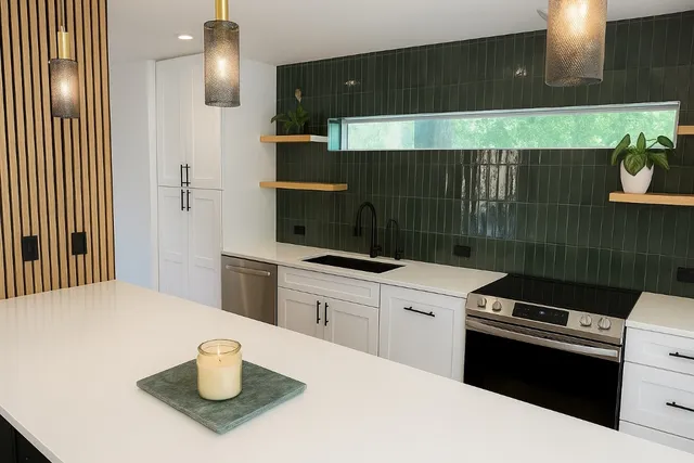 a kitchen with a stove and white cabinets