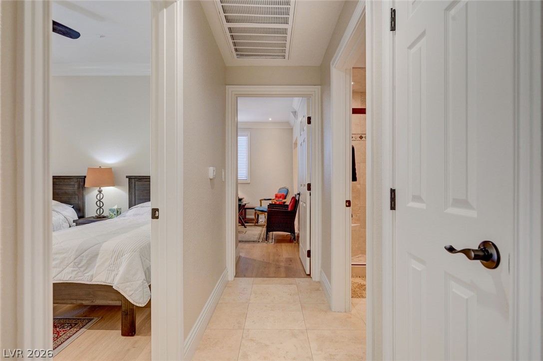 230 East Flamingo Road, Unit 106 Las Vegas, NV 89169 - Photo 12 of 66 A central hall provides access to private rooms within this charming residence.