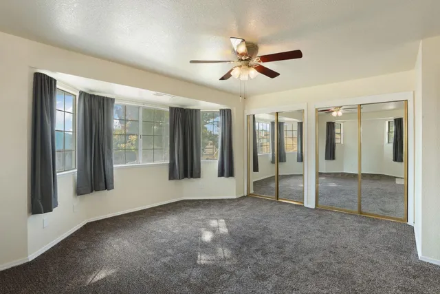 a view of an empty room and fire place