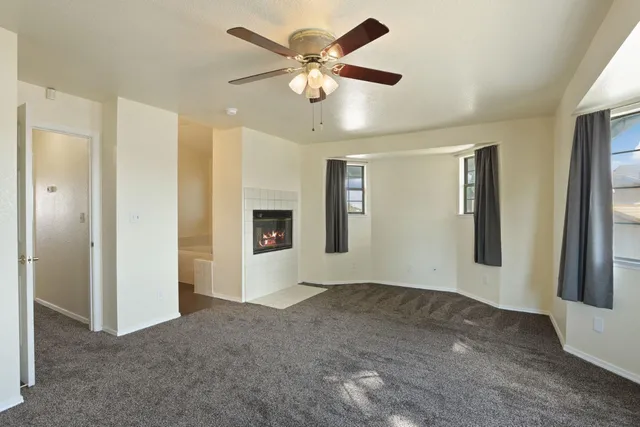 a bathroom with a double vanity sink mirror and toilet