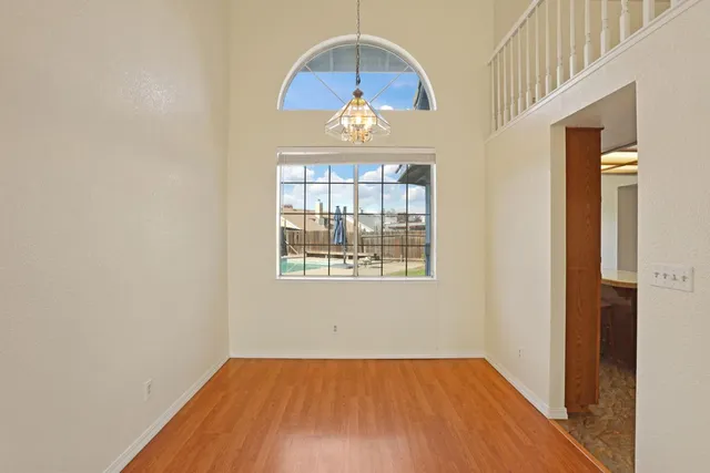 a kitchen with stainless steel appliances granite countertop microwave stove top oven and cabinets