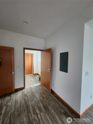 a view of a livingroom with wooden floor and closet