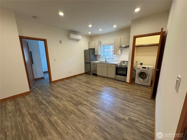 wooden floor in kitchen and a room with wooden floor