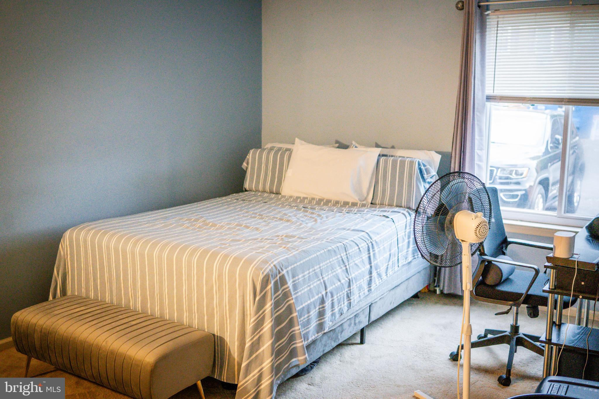 2089 Welsh Road, Unit F1 Philadelphia, PA 19115 - Photo 14 of 27 a bedroom with a bed chair and window