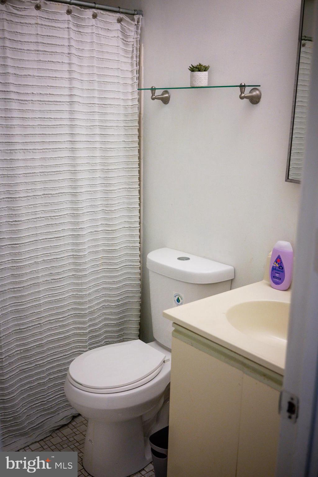 2089 Welsh Road, Unit F1 Philadelphia, PA 19115 - Photo 17 of 27 a white toilet sitting next to a white sink