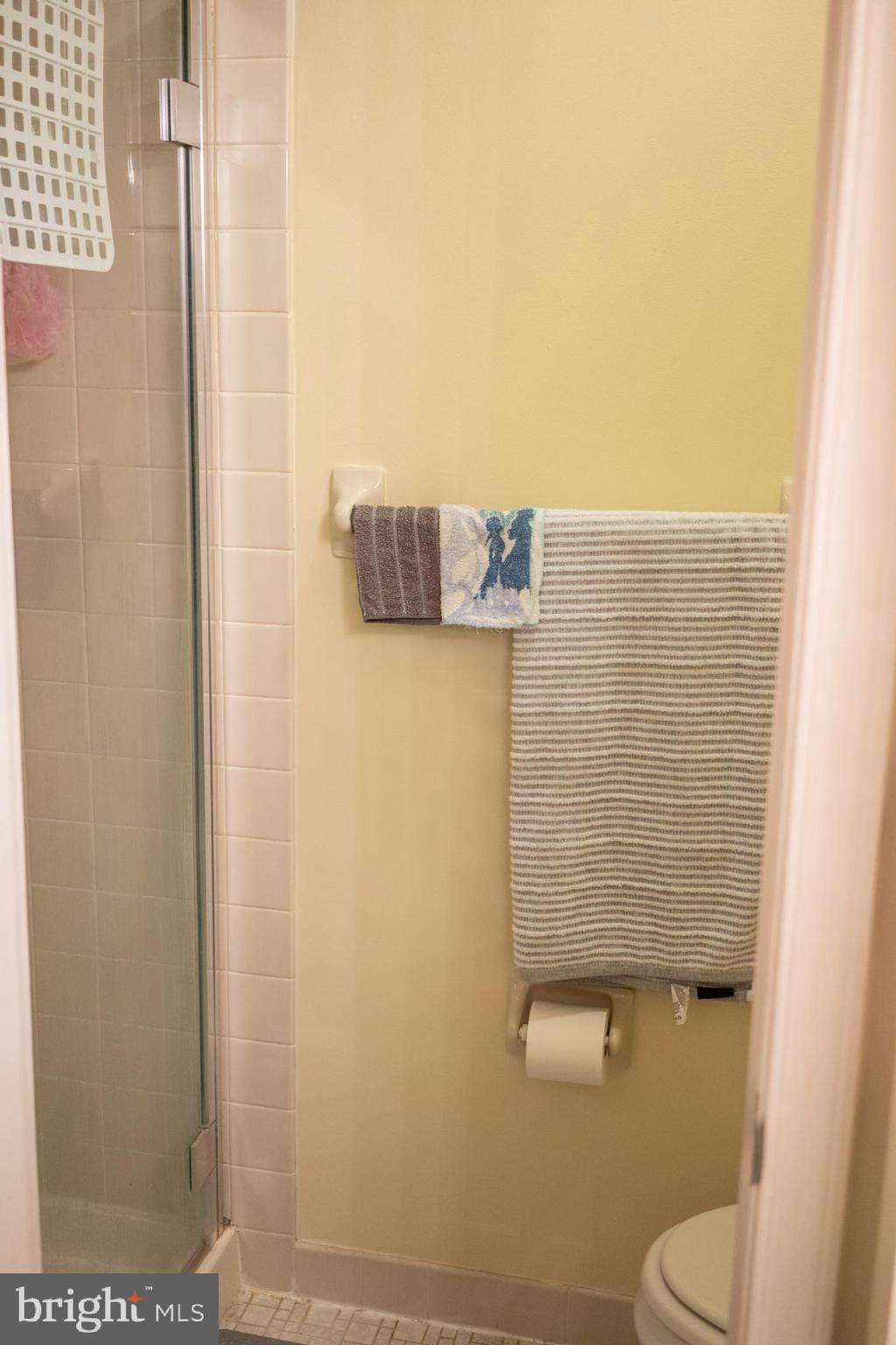 2089 Welsh Road, Unit F1 Philadelphia, PA 19115 - Photo 20 of 27 a bathroom with a toilet and a shower