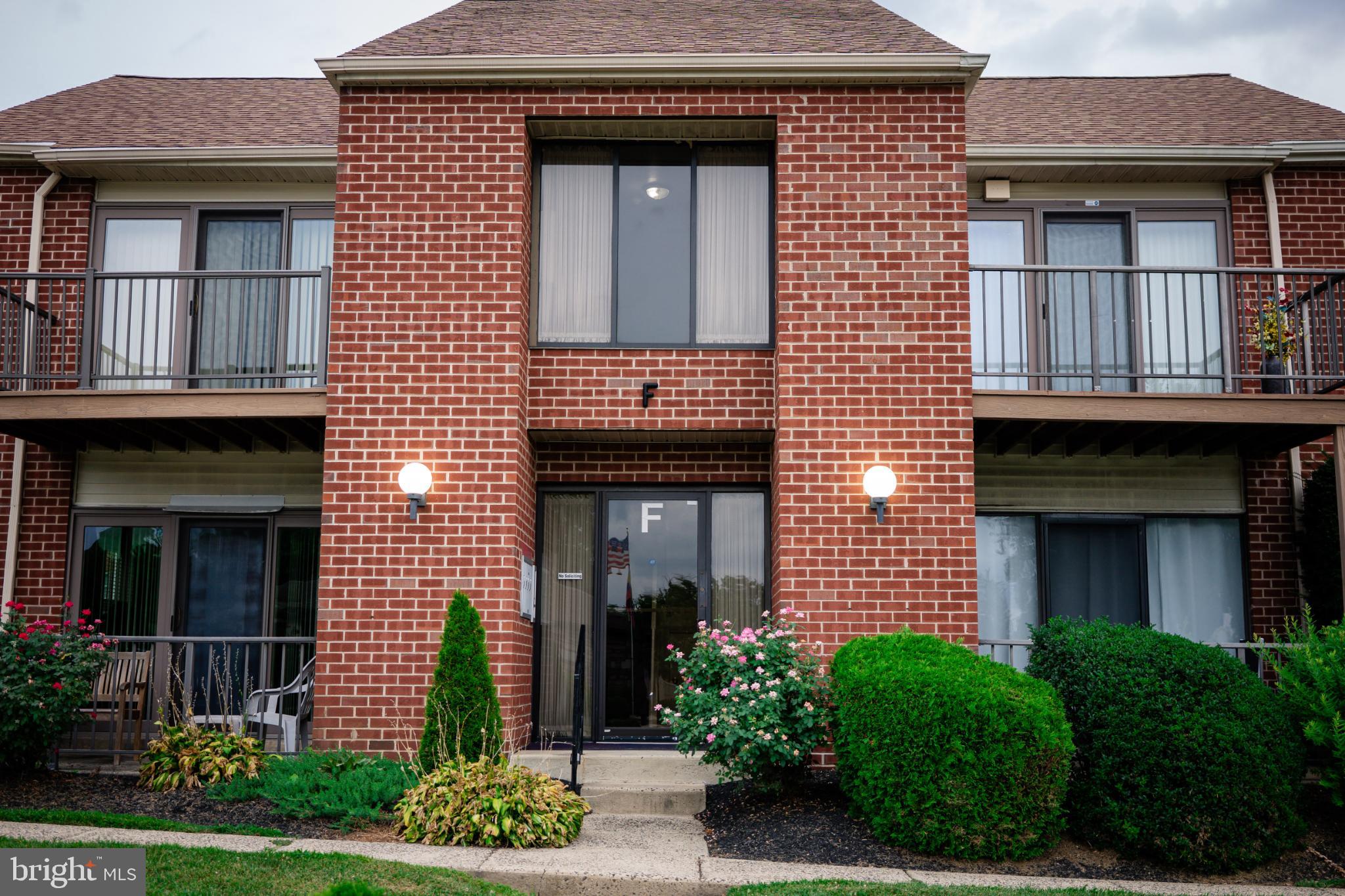 2089 Welsh Road, Unit F1 Philadelphia, PA 19115 - Photo 2 of 27 a front view of a house with garden