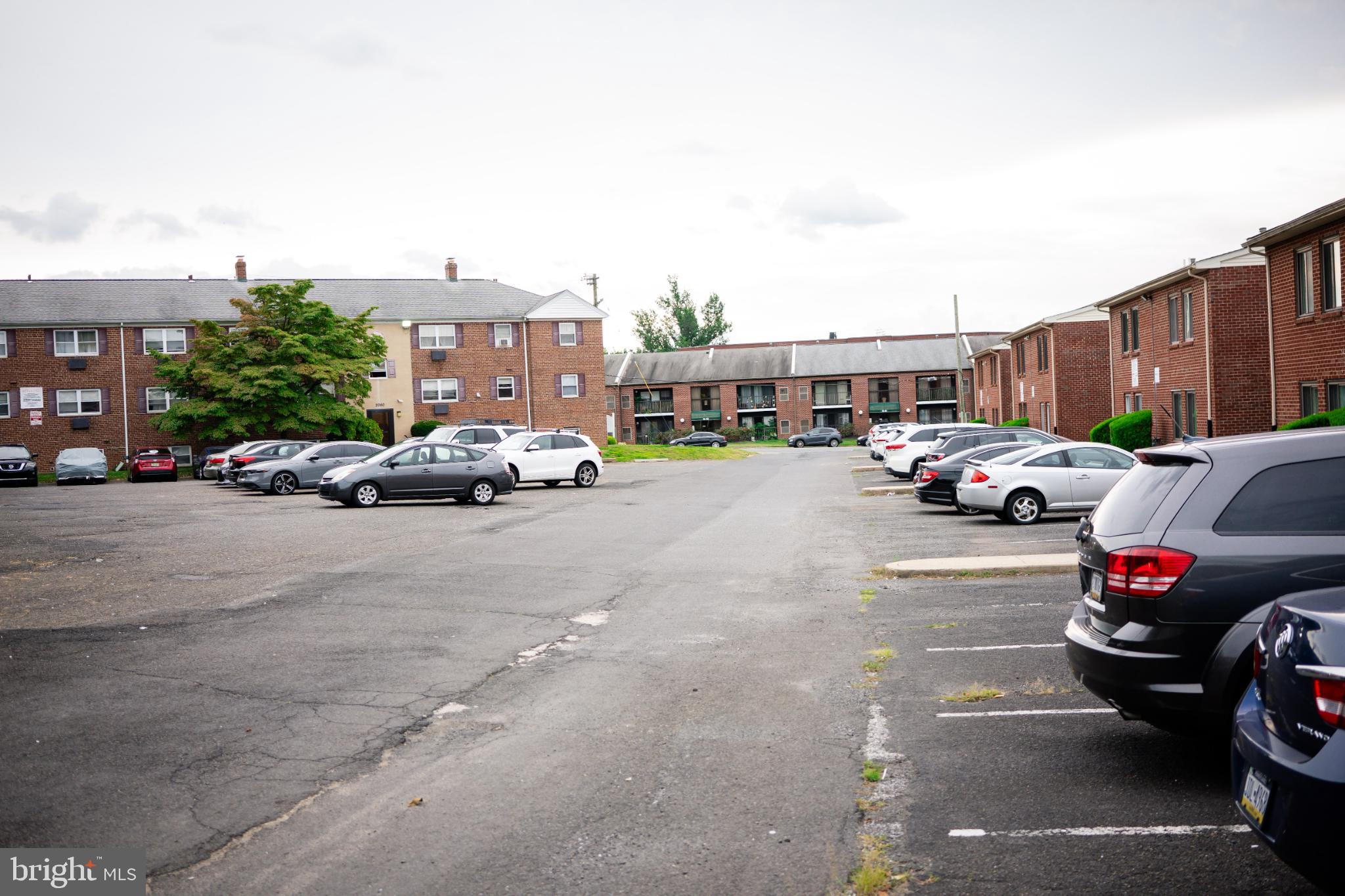 2089 Welsh Road, Unit F1 Philadelphia, PA 19115 - Photo 24 of 27 a cars parked in front of a building