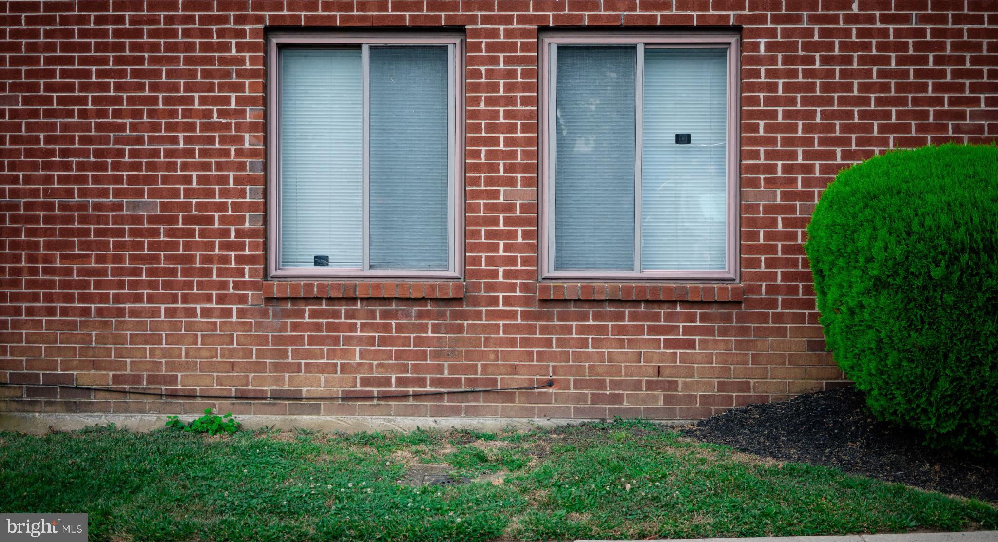 2089 Welsh Road, Unit F1 Philadelphia, PA 19115 - Photo 27 of 27 a front view of a house with a garden