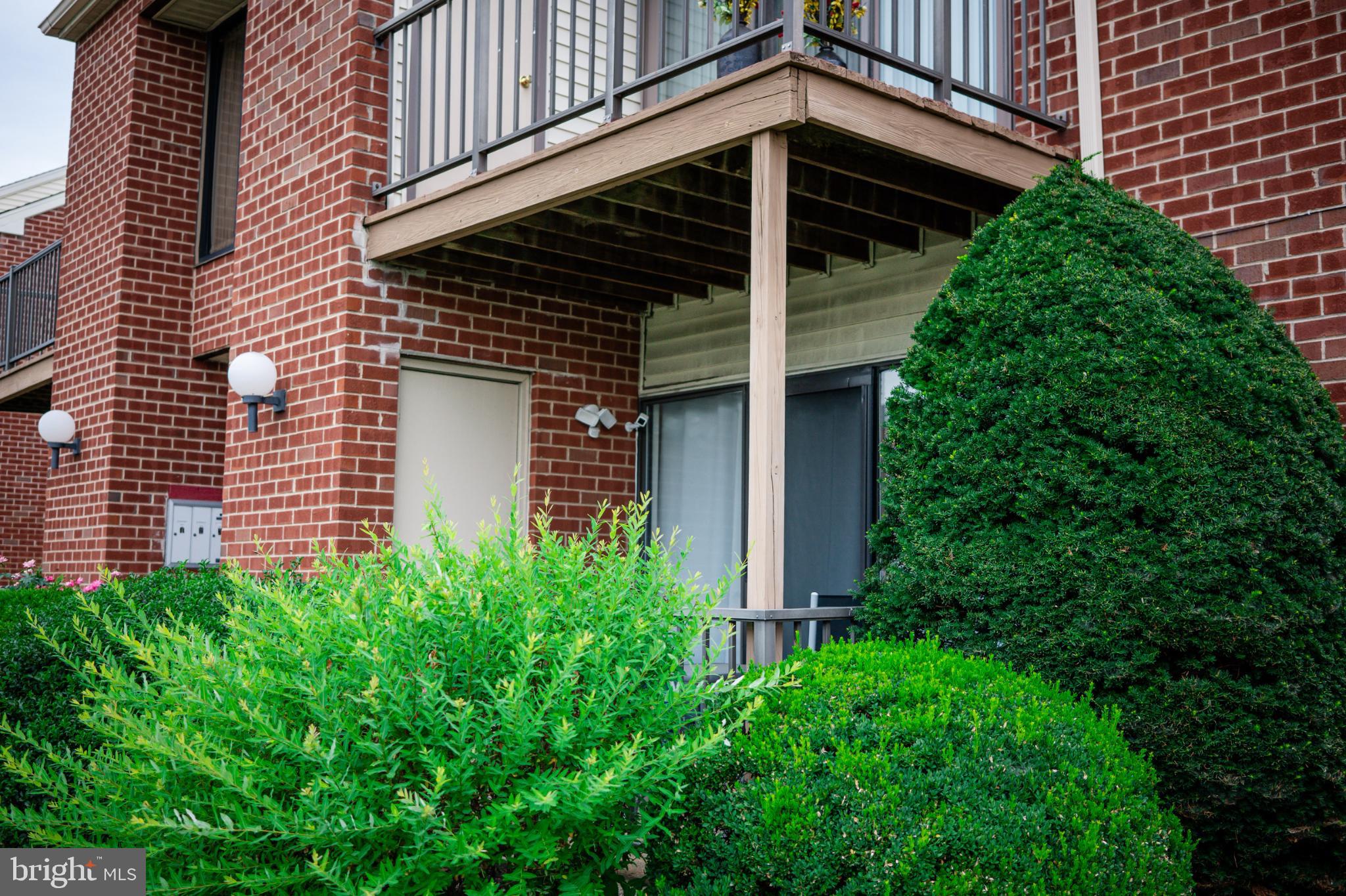 2089 Welsh Road, Unit F1 Philadelphia, PA 19115 - Photo 3 of 27 a view of a house with a yard and garage