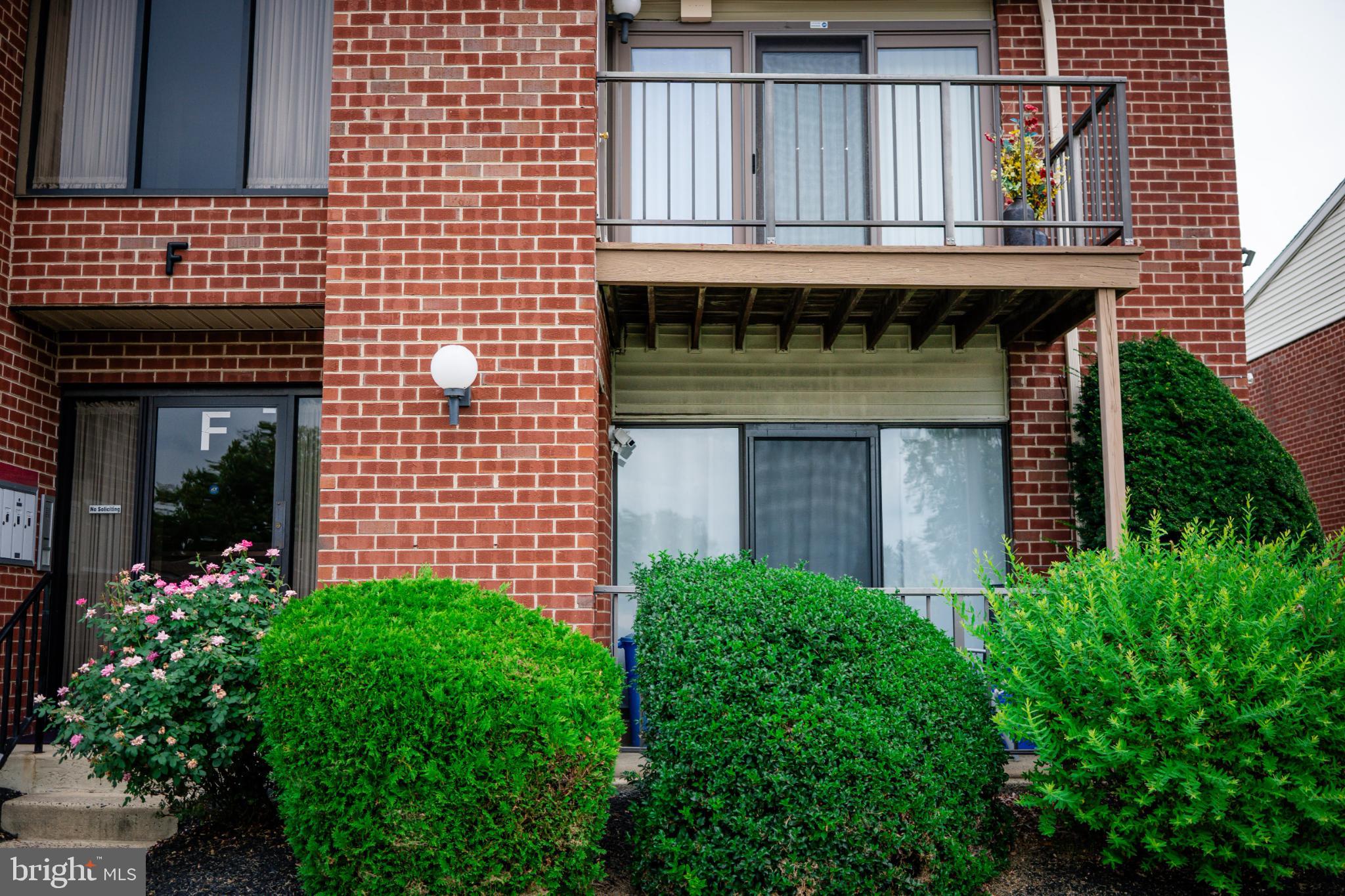 2089 Welsh Road, Unit F1 Philadelphia, PA 19115 - Photo 4 of 27 a front view of a house with plants