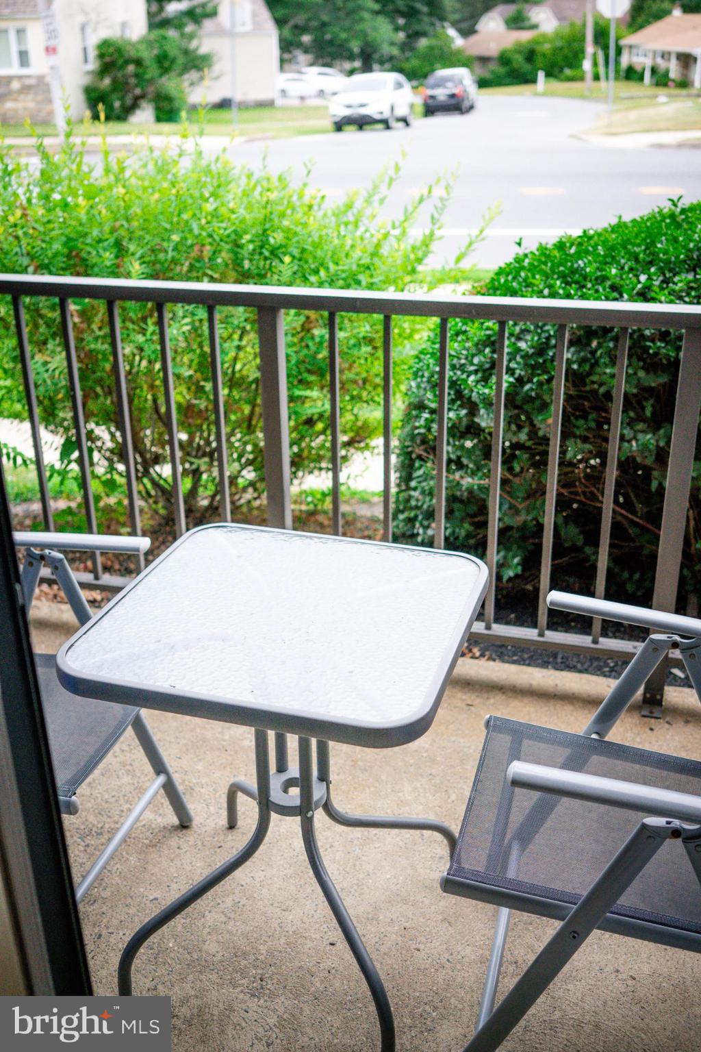 2089 Welsh Road, Unit F1 Philadelphia, PA 19115 - Photo 8 of 27 a view of a balcony with a table and chairs