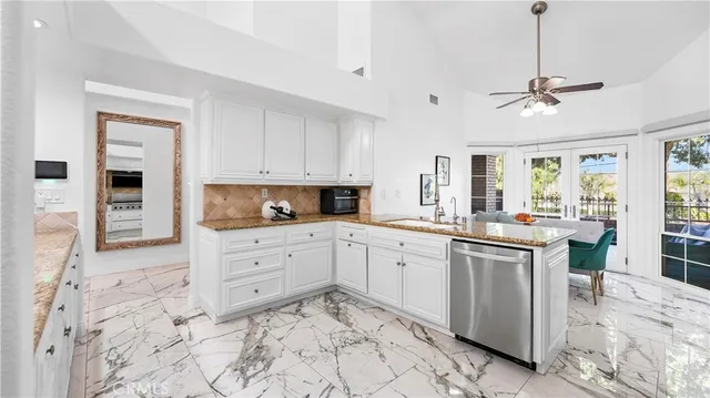 an aerial view of residential houses with city view