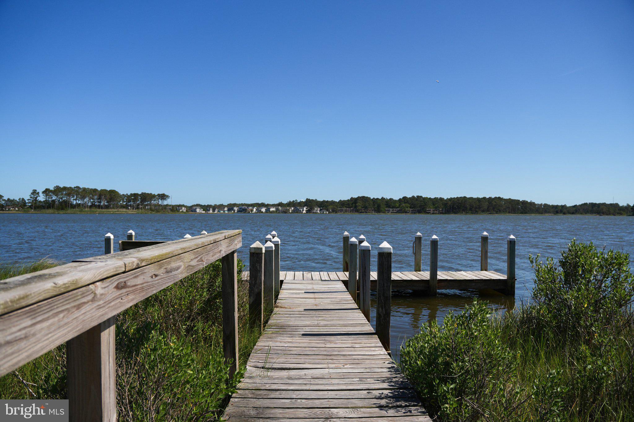 402 Salt Pond Road Bethany Beach, DE 19930 - Photo 49 of 55 Tranquil dock by serene waters.