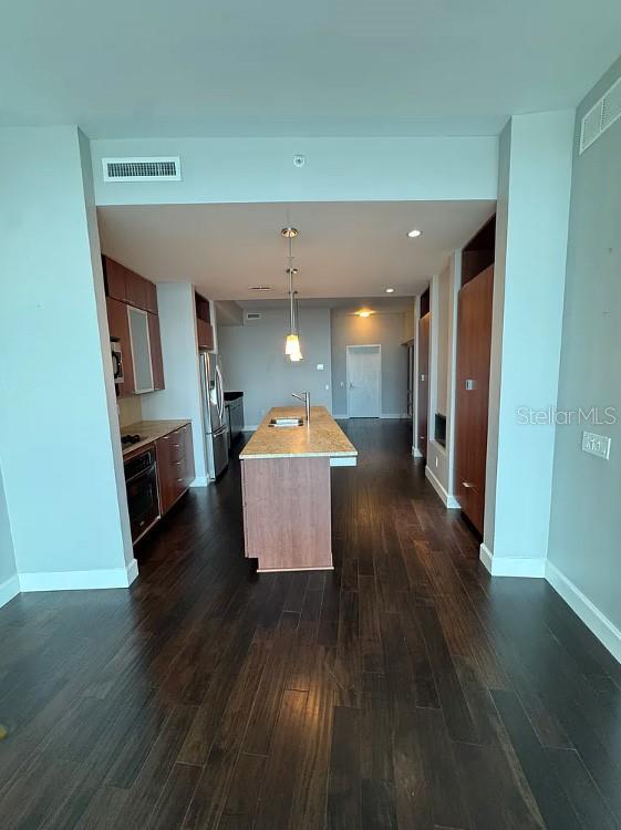 912 Channelside Drive, Unit 2803 Tampa, FL 33602 - Photo 15 of 34 a room with wooden floor and furniture