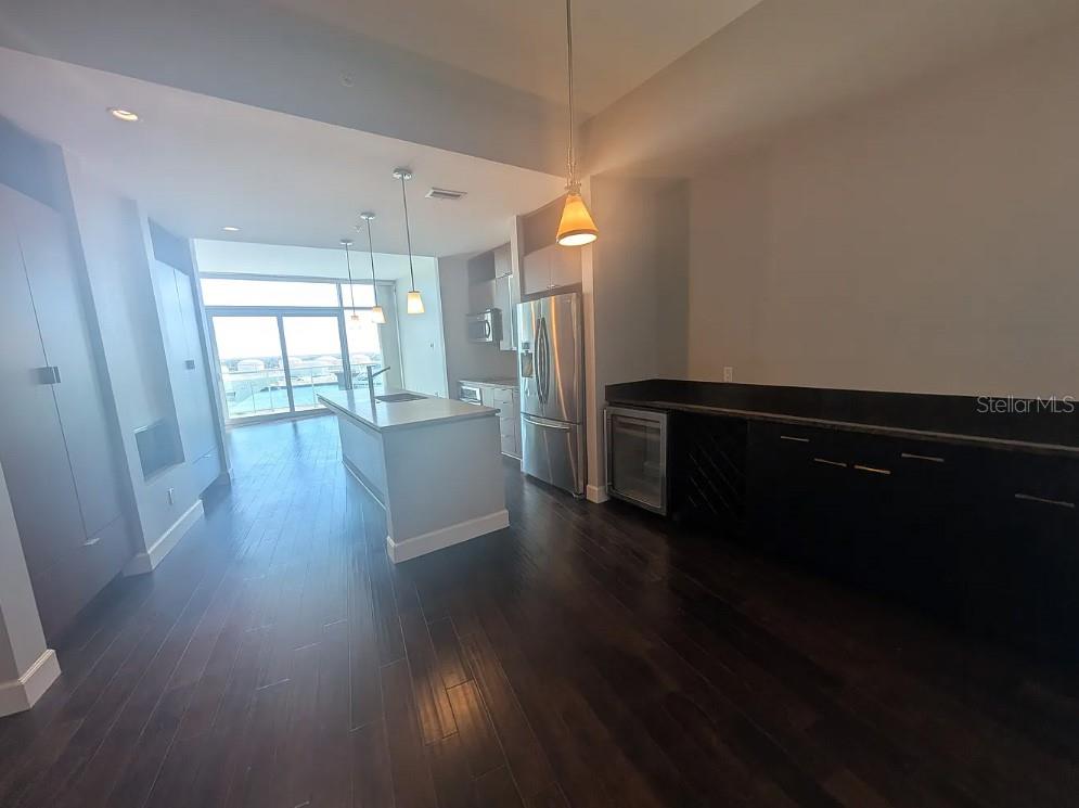 912 Channelside Drive, Unit 2803 Tampa, FL 33602 - Photo 32 of 34 a view of a kitchen with wooden floor and electronic appliances