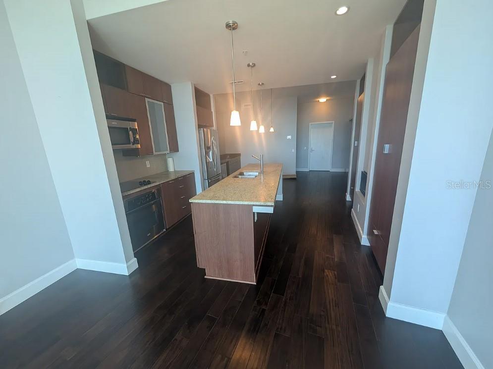 912 Channelside Drive, Unit 2803 Tampa, FL 33602 - Photo 34 of 34 a view of a hallway with wooden floor and staircase