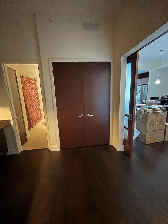 912 Channelside Drive, Unit 2803 Tampa, FL 33602 - Photo 5 of 34 a view of an empty room with wooden floor and a window