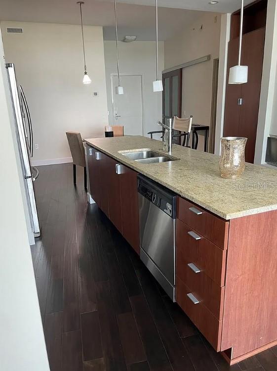 912 Channelside Drive, Unit 2803 Tampa, FL 33602 - Photo 9 of 34 a bathroom with a granite countertop sink a mirror and vanity