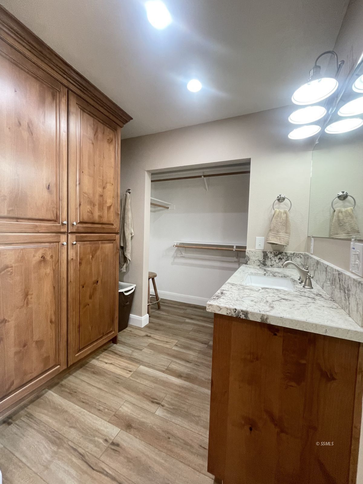 1031 North Sierra View Street Ridgecrest, CA 93555 - Photo 23 of 33 a kitchen with kitchen island granite countertop a refrigerator and a sink