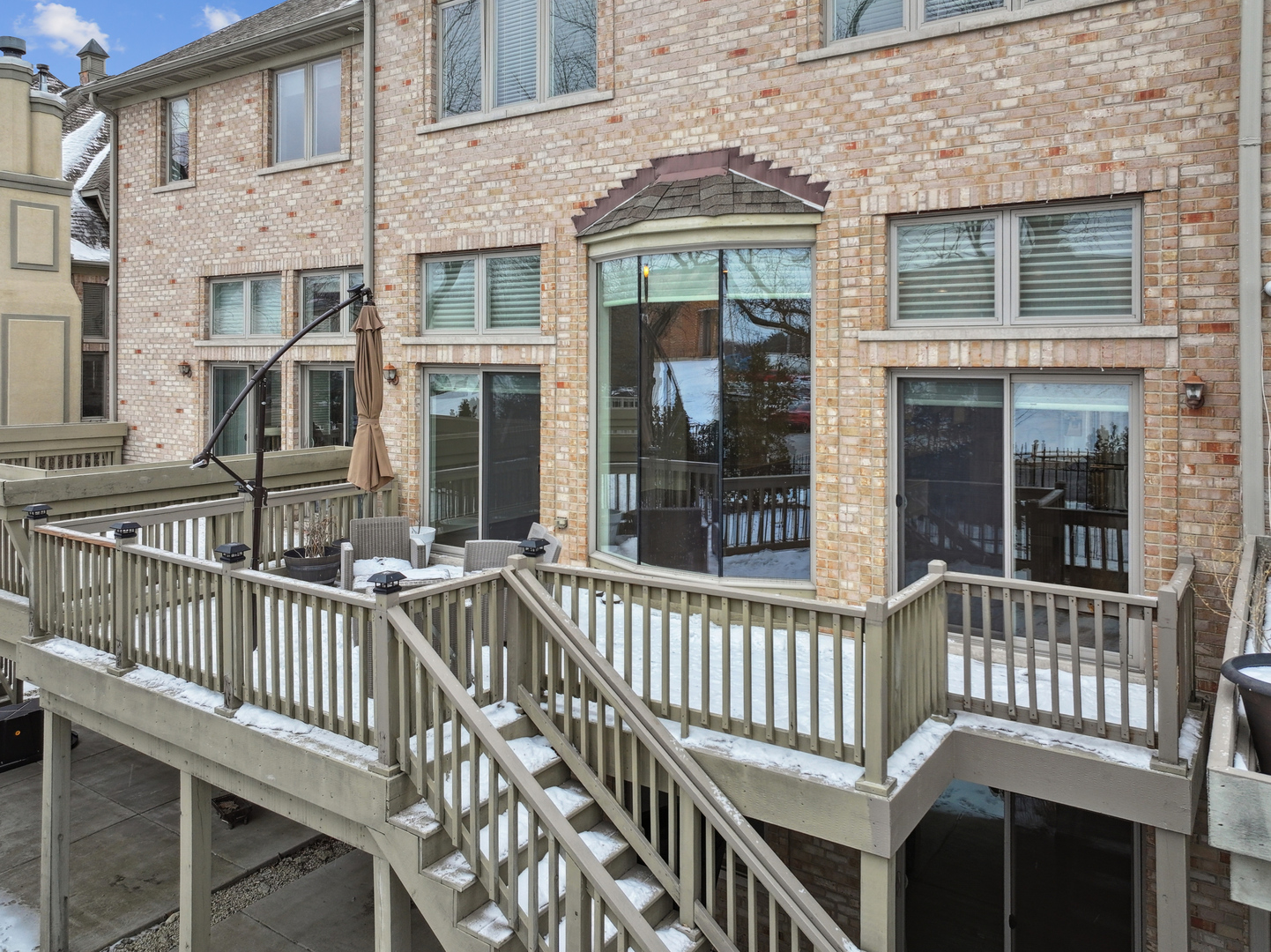 1407 Rue Paris Place Inverness, IL 60067 - Photo 31 of 38 front view of a brick house with a large windows