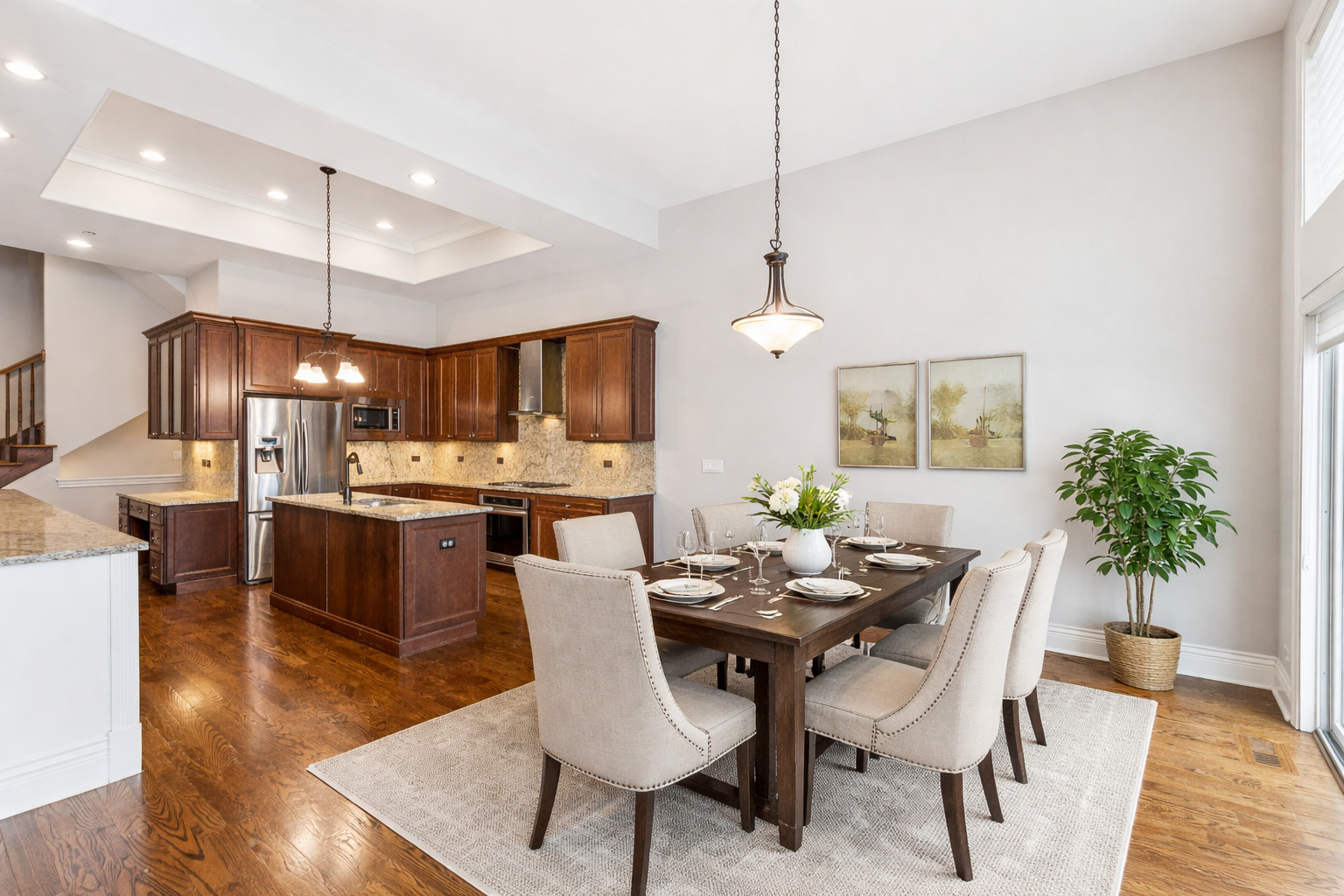1407 Rue Paris Place Inverness, IL 60067 - Photo 4 of 38 a view of a dining room and livingroom with furniture wooden floor a chandelier