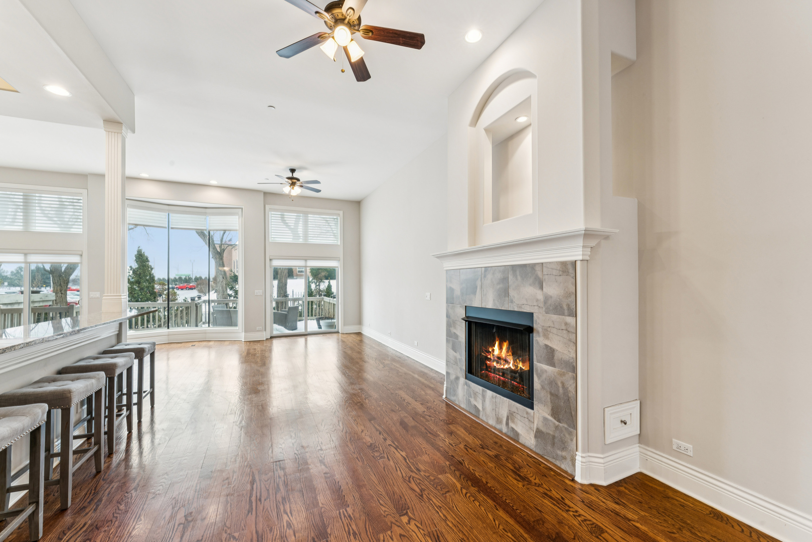 1407 Rue Paris Place Inverness, IL 60067 - Photo 6 of 38 a living room with wooden floors and fireplace