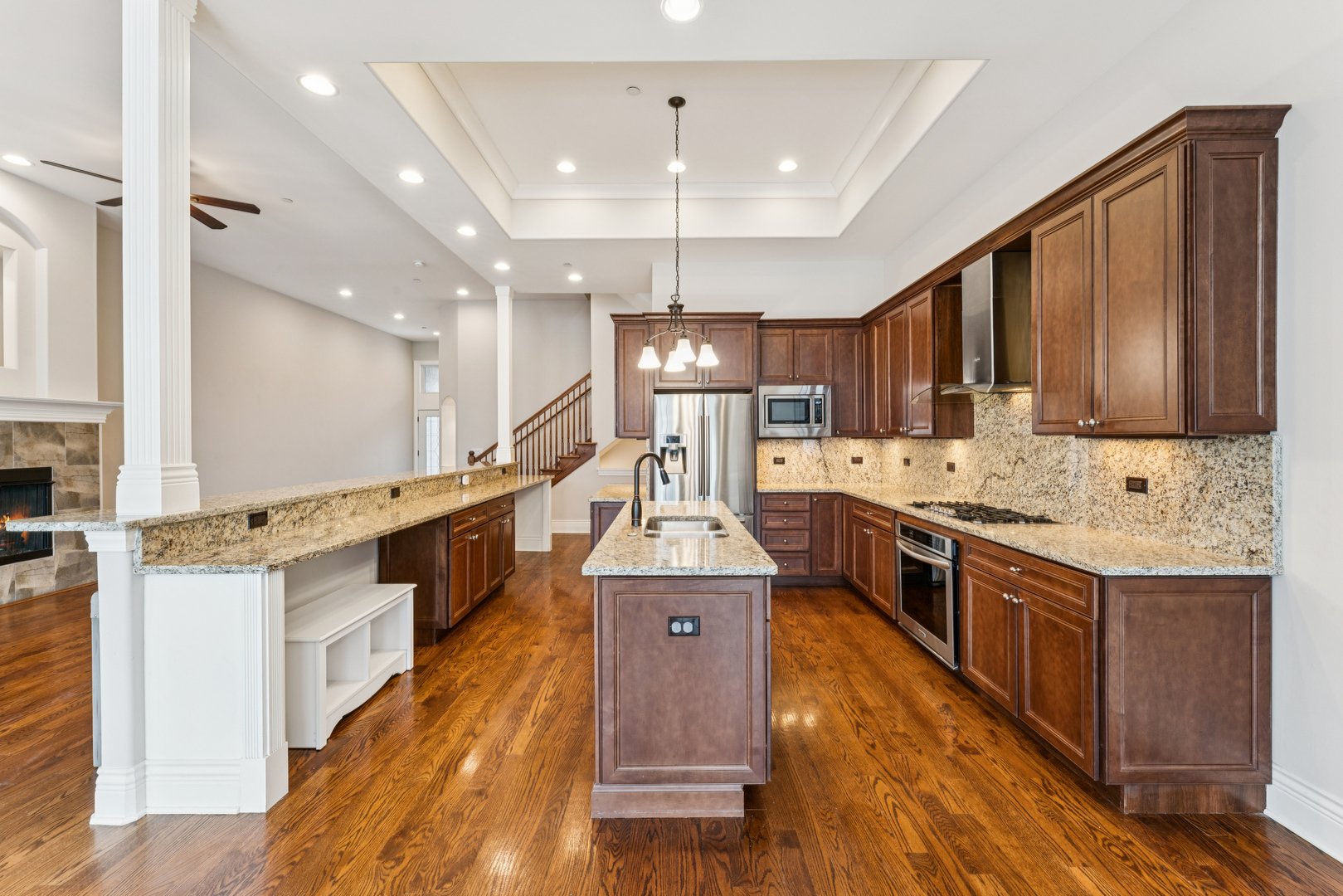 1407 Rue Paris Place Inverness, IL 60067 - Photo 7 of 38 a large kitchen with stainless steel appliances granite countertop a stove oven a refrigerator a oven and a cabinets with wooden floor