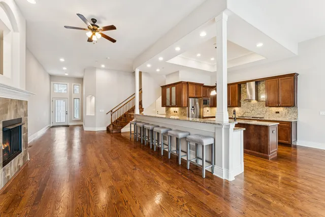 a view of kitchen with cabinets and wooden floor