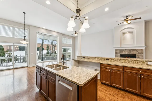 a bathroom with a granite countertop sink a large mirror and vanity