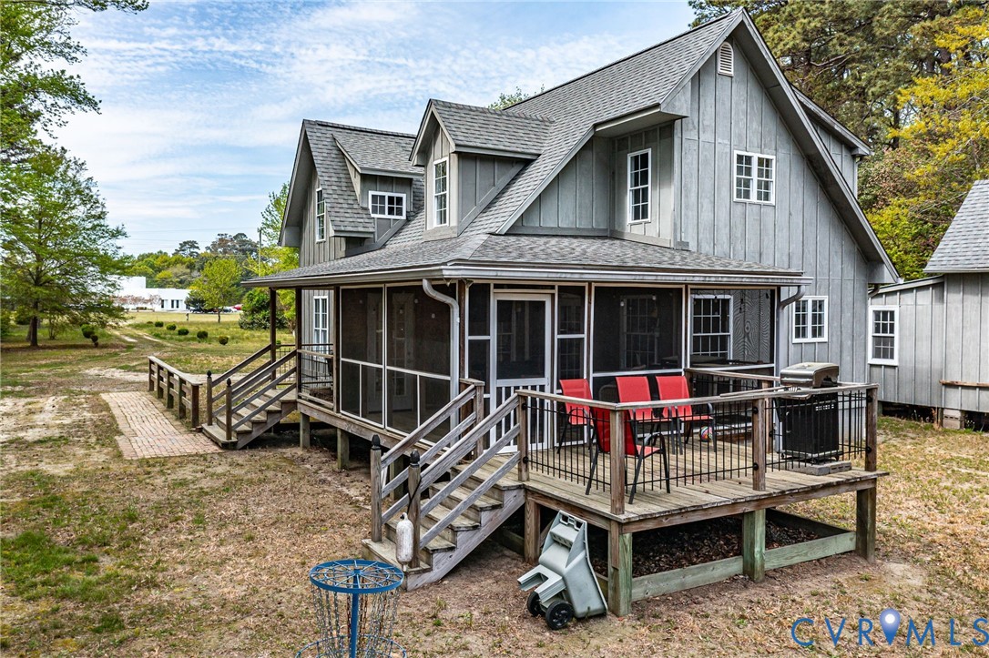 193 Deep Water Lane Reedville, VA 22539 - Photo 56 of 84 a view of a house with a patio and a garden