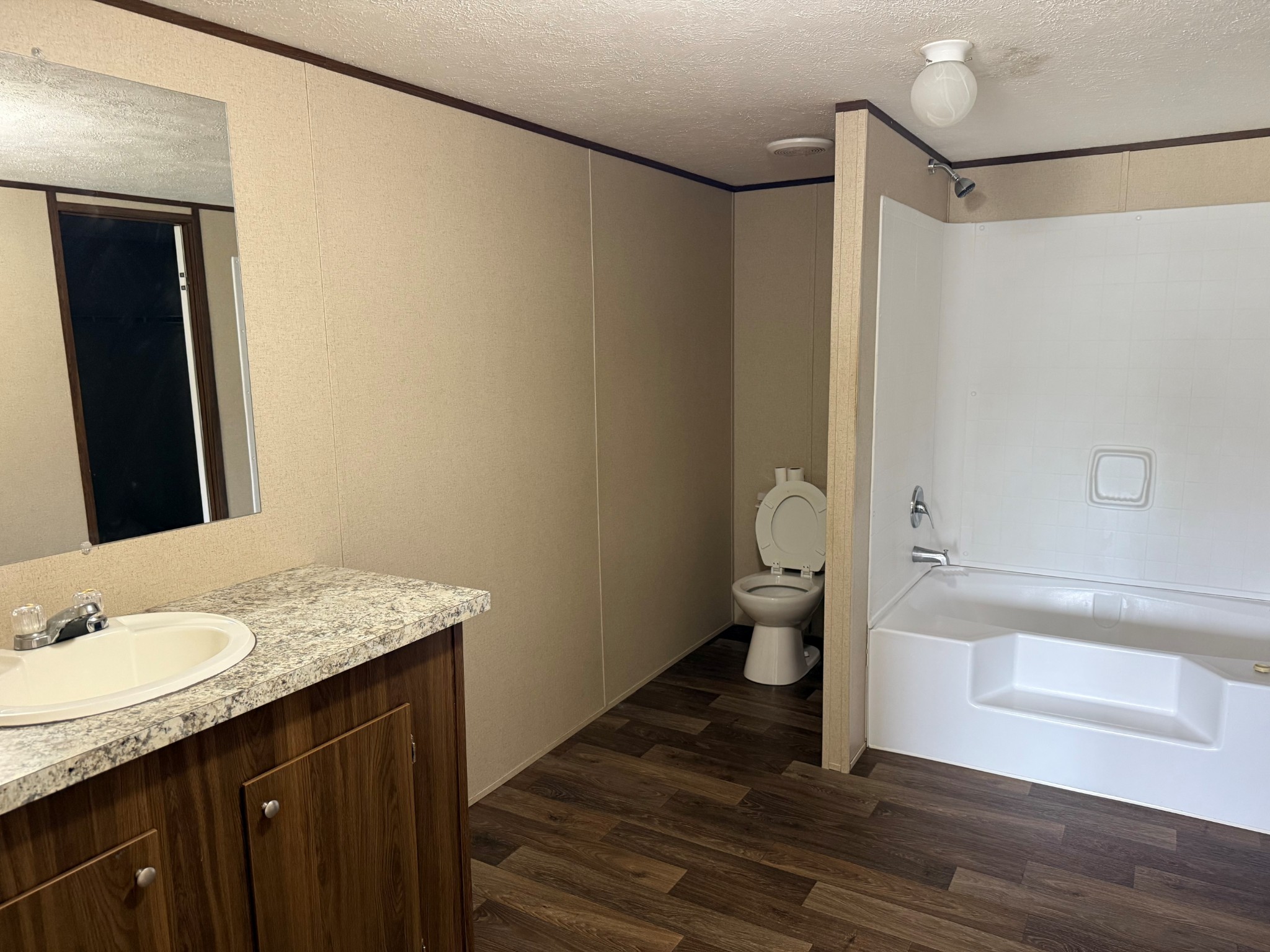 980 Market Street Ardmore, TN 38449 - Photo 12 of 19 a bathroom with a granite countertop sink toilet and shower