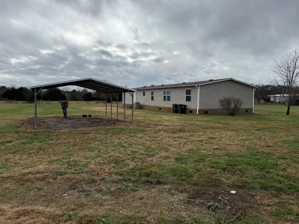 a backyard of a house with lots of green space