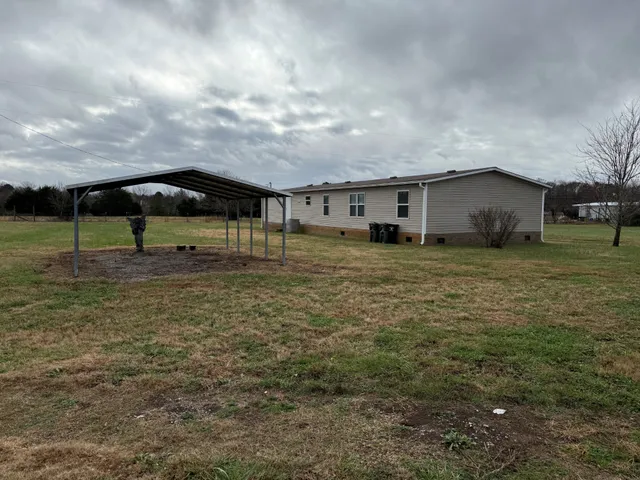 a backyard of a house with lots of green space