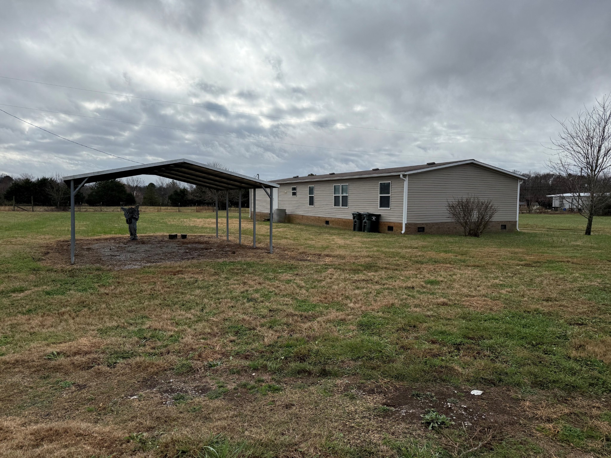 980 Market Street Ardmore, TN 38449 - Photo 16 of 19 a backyard of a house with lots of green space