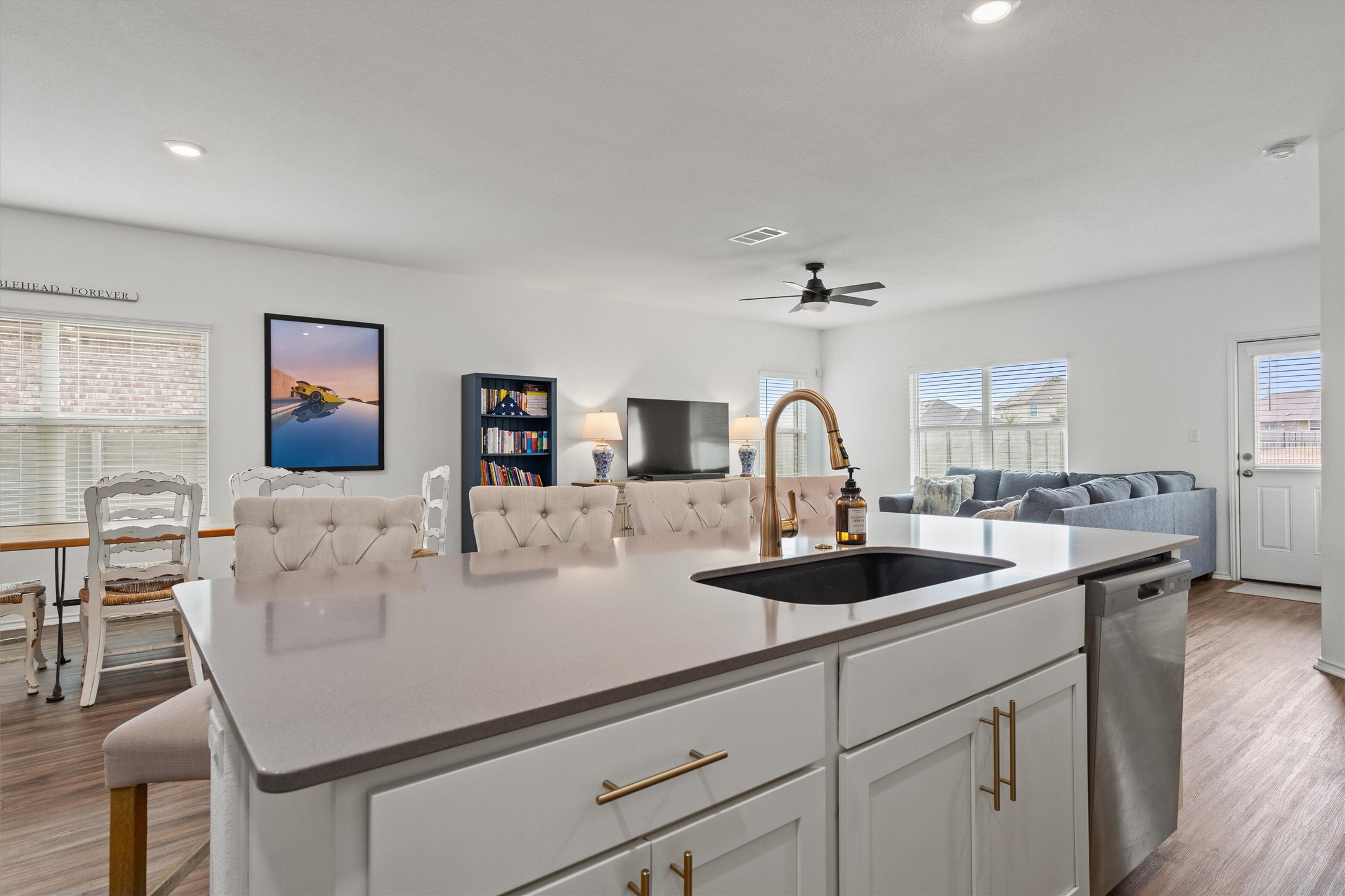 424 Wolf Springs Road Georgetown, TX 78628 - Photo 12 of 35 a kitchen with a sink and a refrigerator