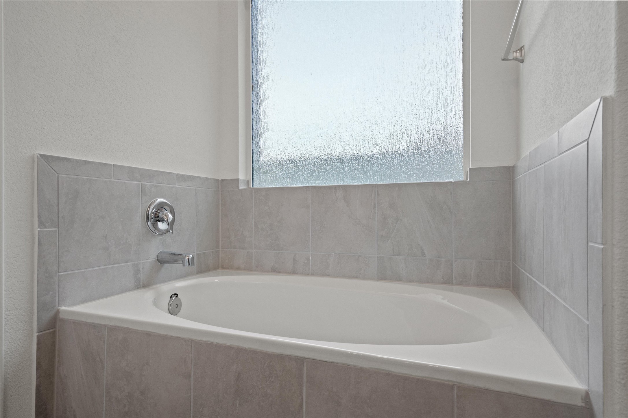 424 Wolf Springs Road Georgetown, TX 78628 - Photo 19 of 37 a white bath tub sitting next to a white sink and vanity