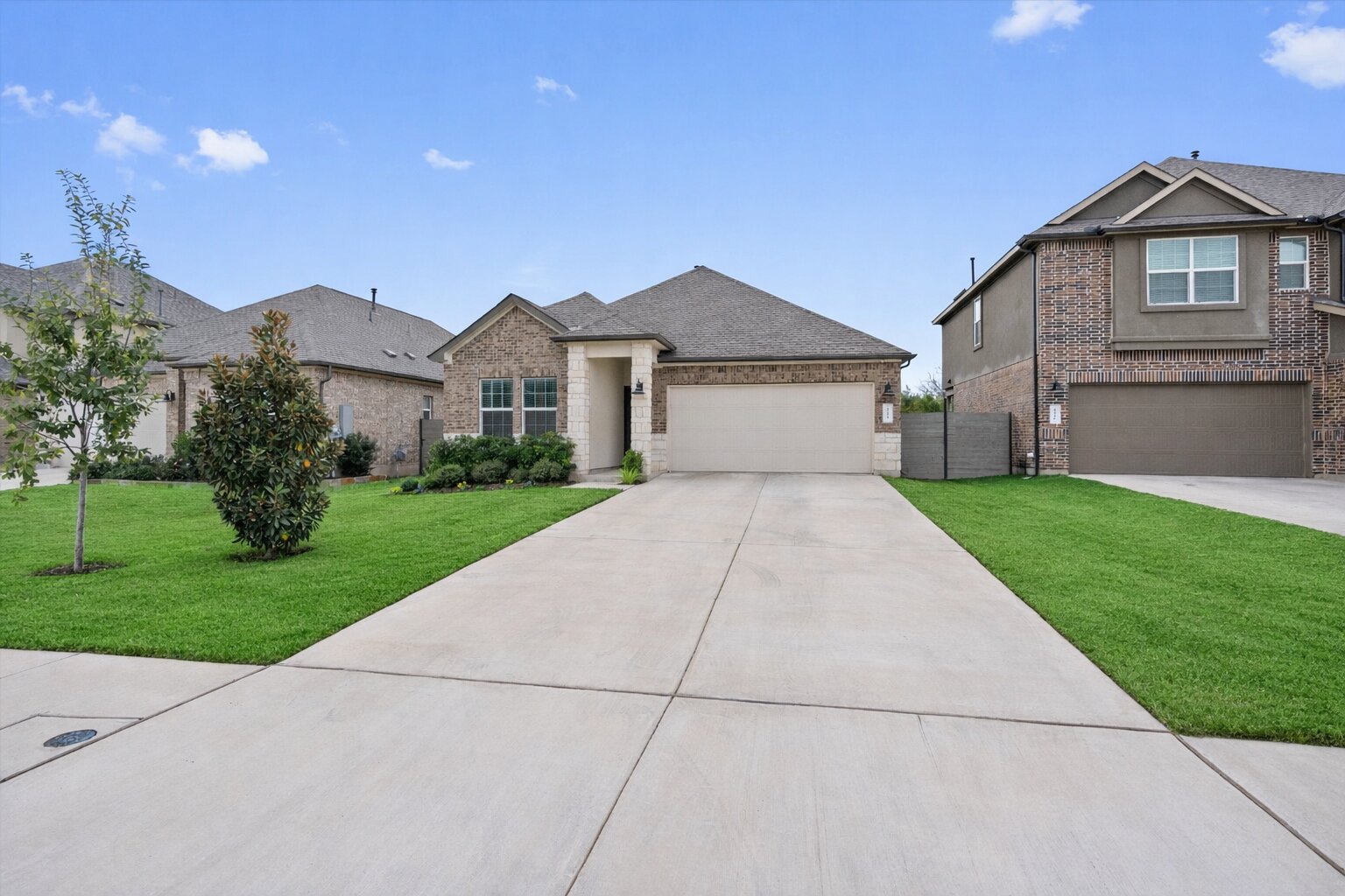 424 Wolf Springs Road Georgetown, TX 78628 - Photo 2 of 37 a front view of a house with a yard and garage