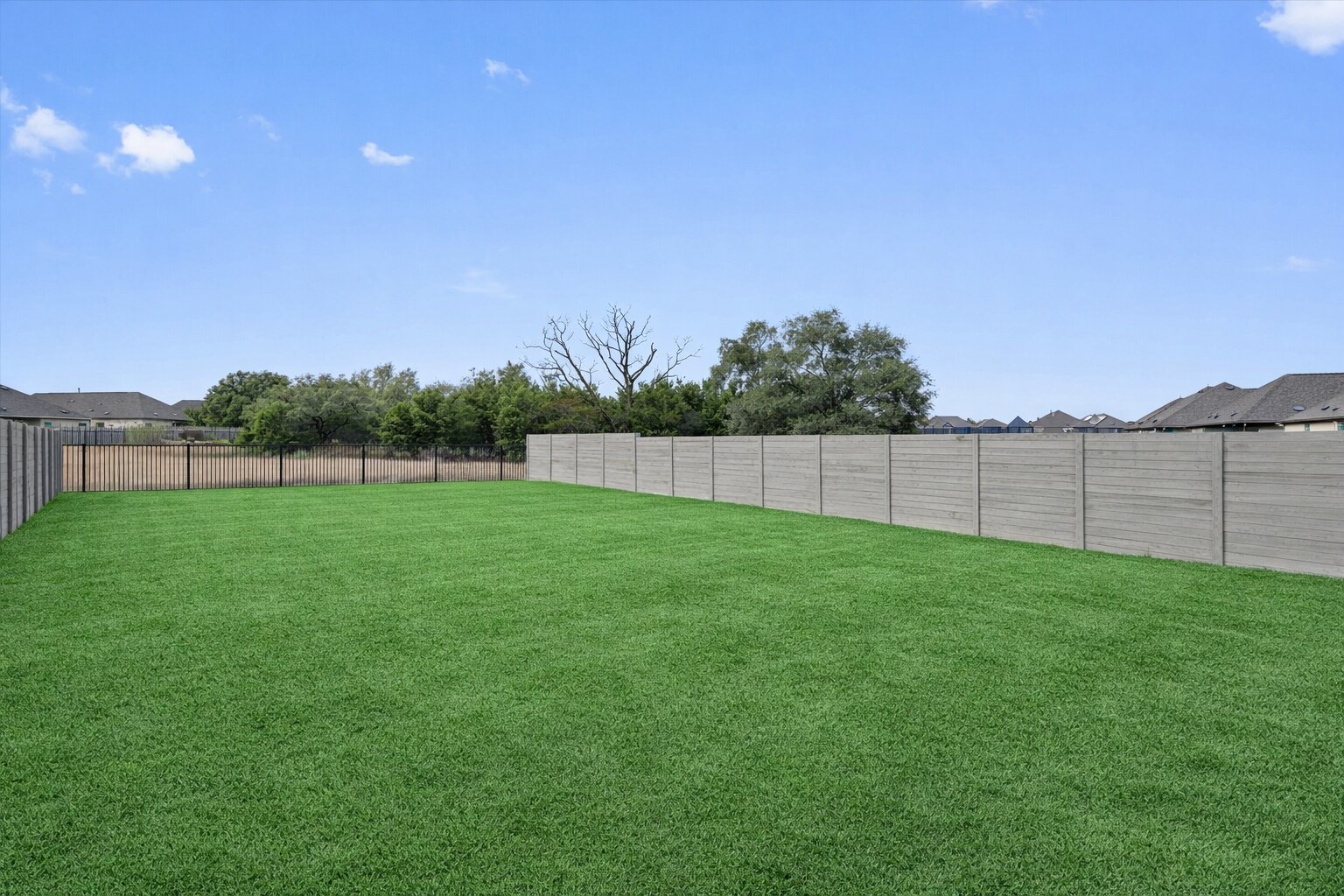 424 Wolf Springs Road Georgetown, TX 78628 - Photo 32 of 37 a view of yard with grass and a fence