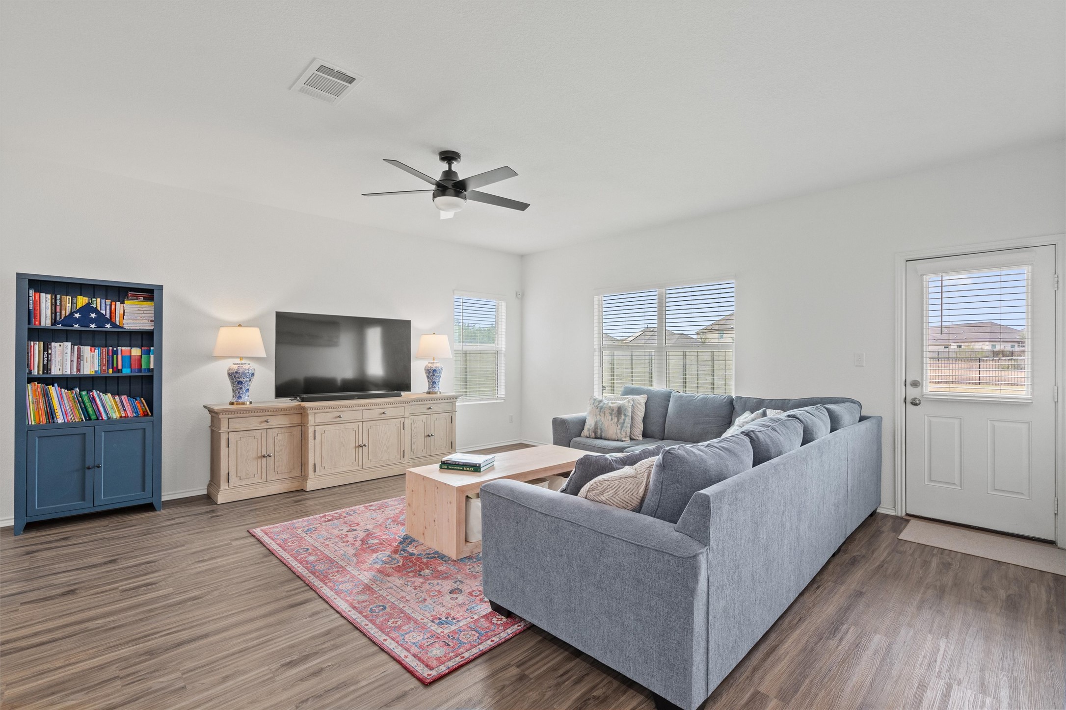 424 Wolf Springs Road Georgetown, TX 78628 - Photo 4 of 37 a living room with furniture and a flat screen tv