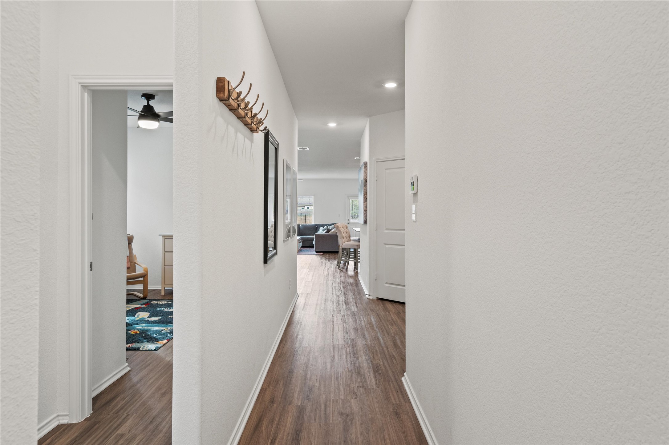 424 Wolf Springs Road Georgetown, TX 78628 - Photo 8 of 37 a view of hallway with wooden floor